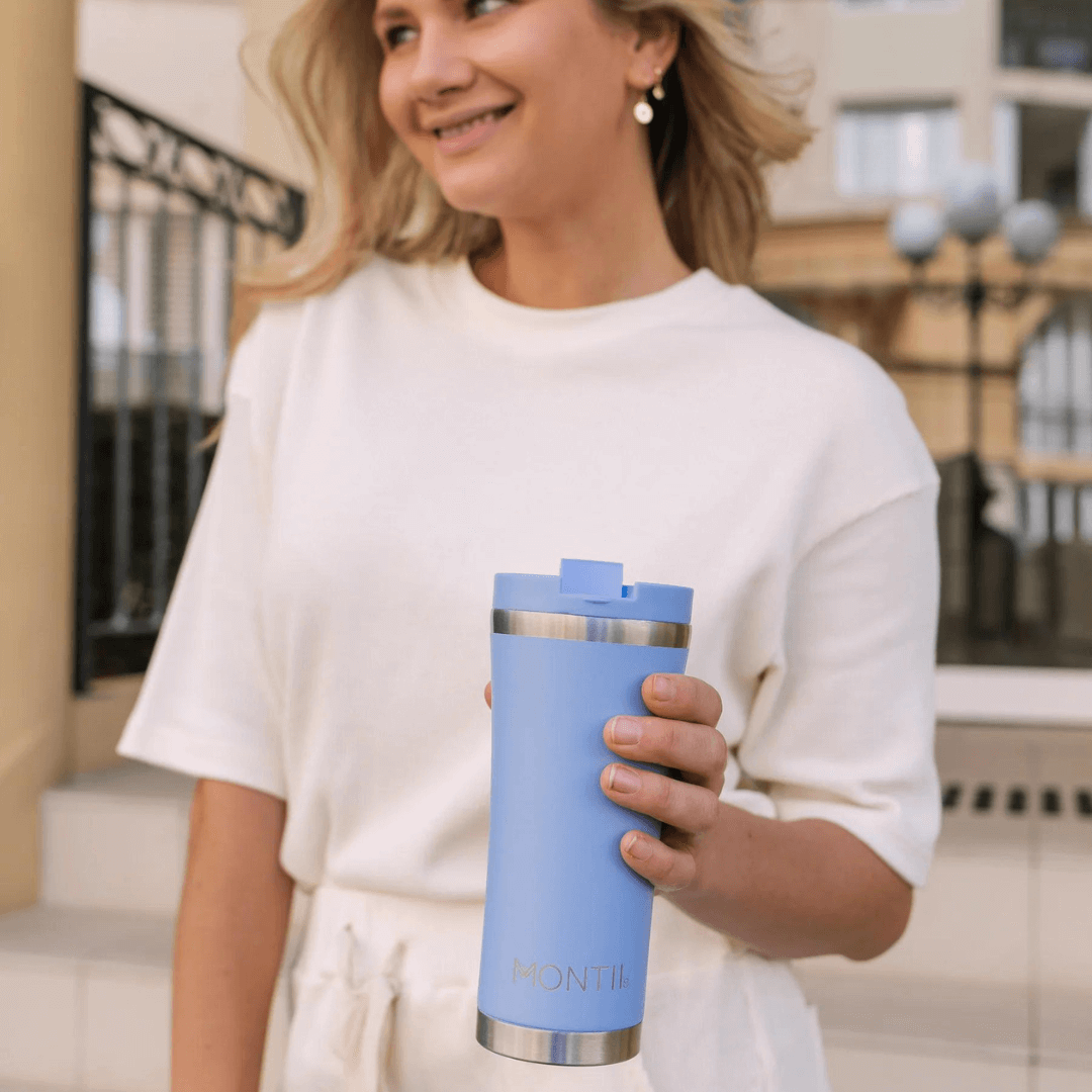 Lady holding Montii mega coffee cup in sky blue colour